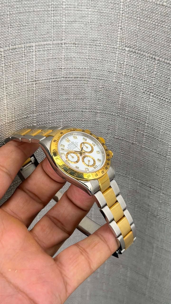 May be an image of wrist watch and text