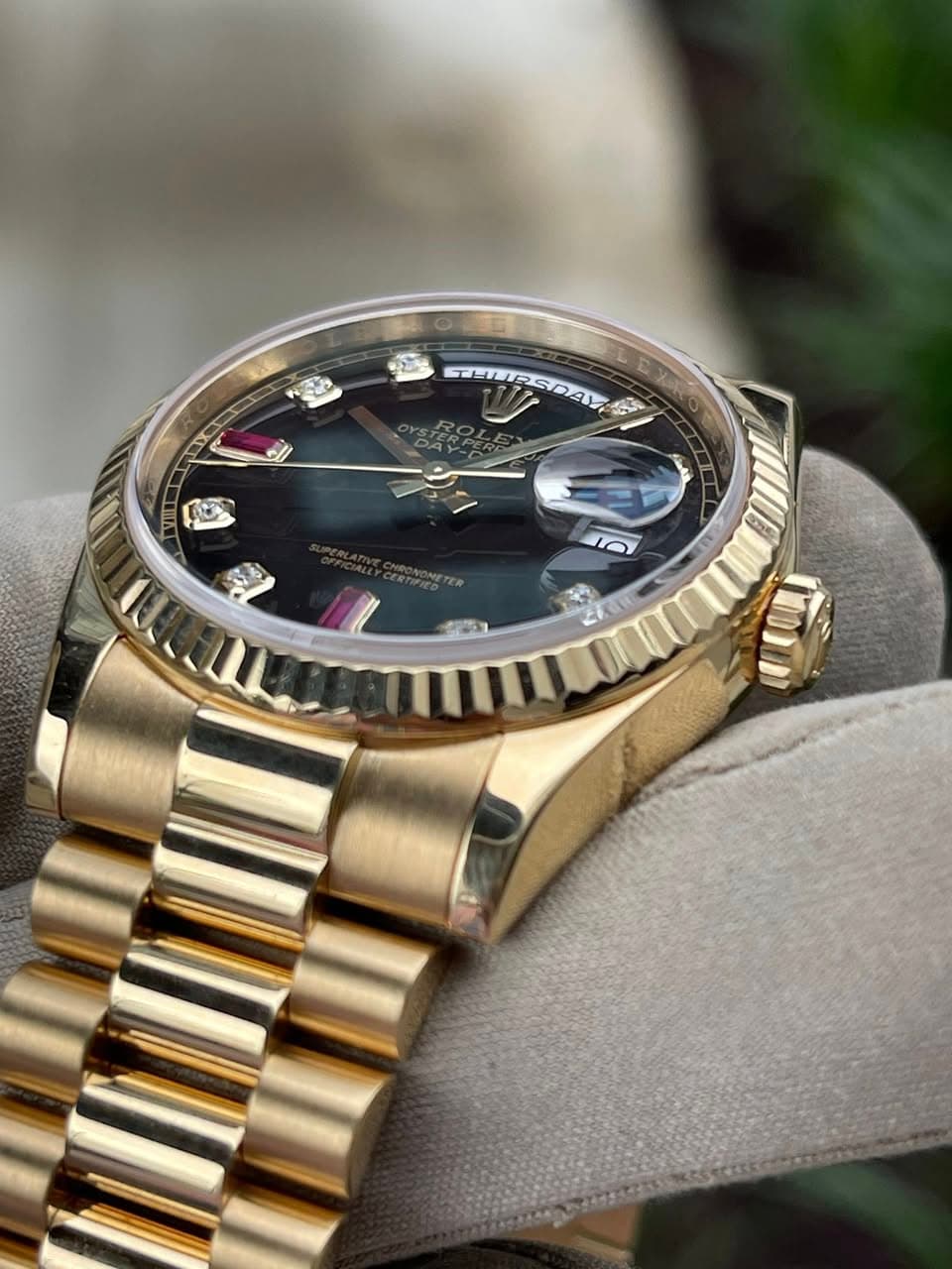 May be an image of wrist watch and text