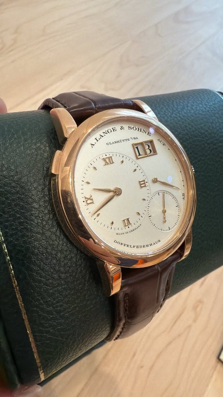 May be an image of wrist watch and leather