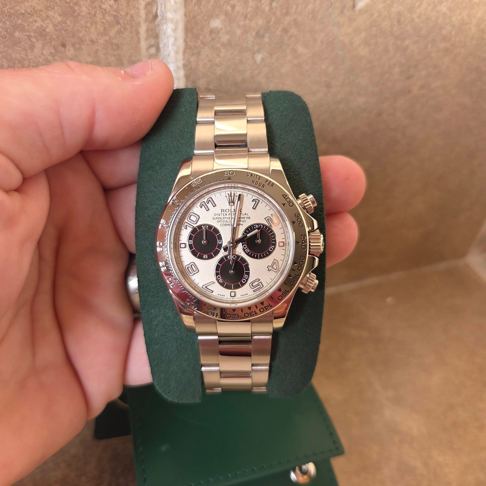 May be an image of wrist watch and text