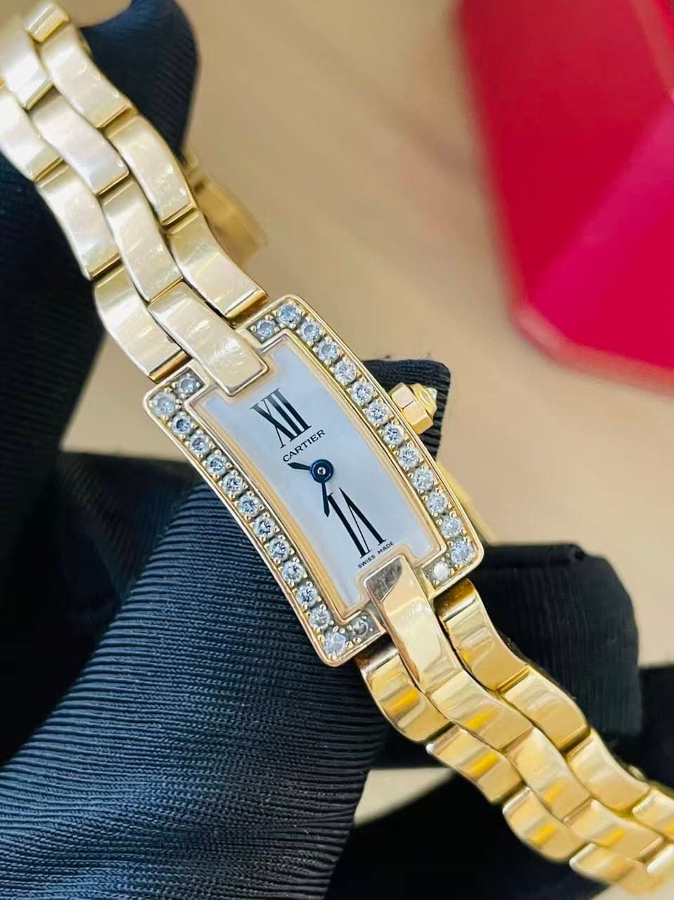 May be an image of wrist watch, jewelry and text