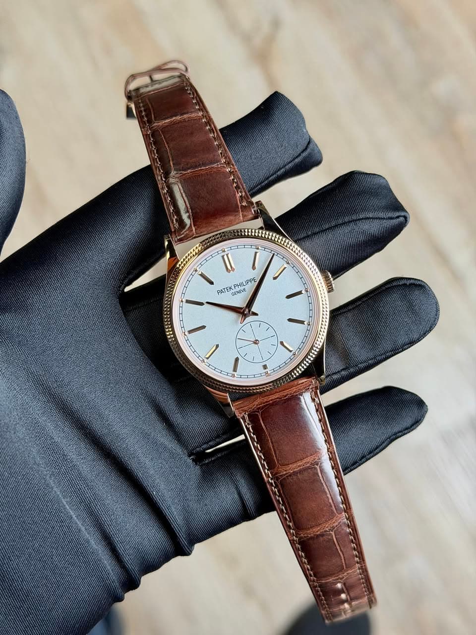 May be an image of wrist watch, leather and text