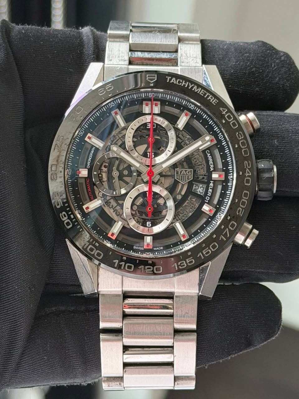 May be an image of wrist watch and text that says '대크링 စတး 50 DHRONCGRAP 3 TACHYMETRE TACH METRE TRE 400 300 f 0 F 5 TAG CARRERA ® رات o 息 O63n3H EUE 00 6 MADE MADE 00 25 SWISS…