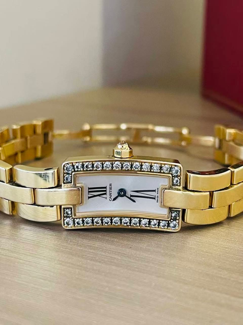 May be an image of wrist watch, jewelry and text that says 'CARTIER'