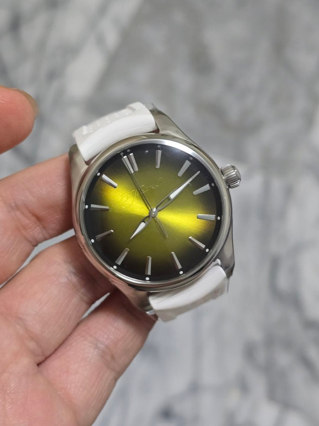 May be an image of wrist watch and text