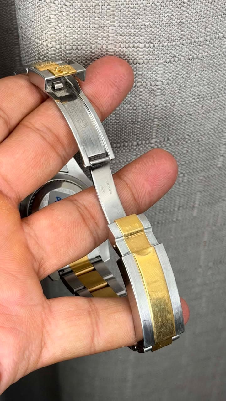 May be an image of wrist watch and jewelry