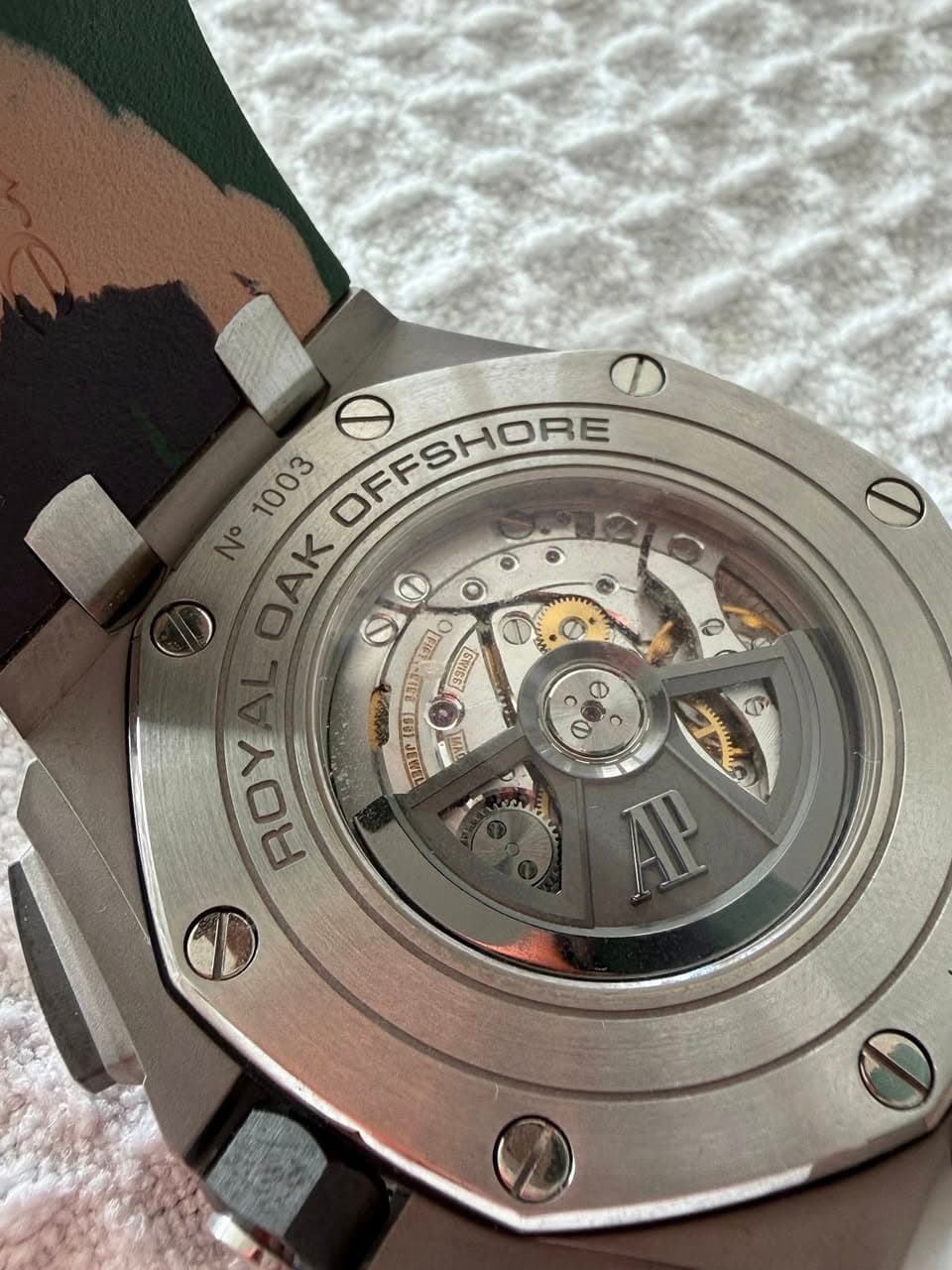 May be an image of wrist watch and text
