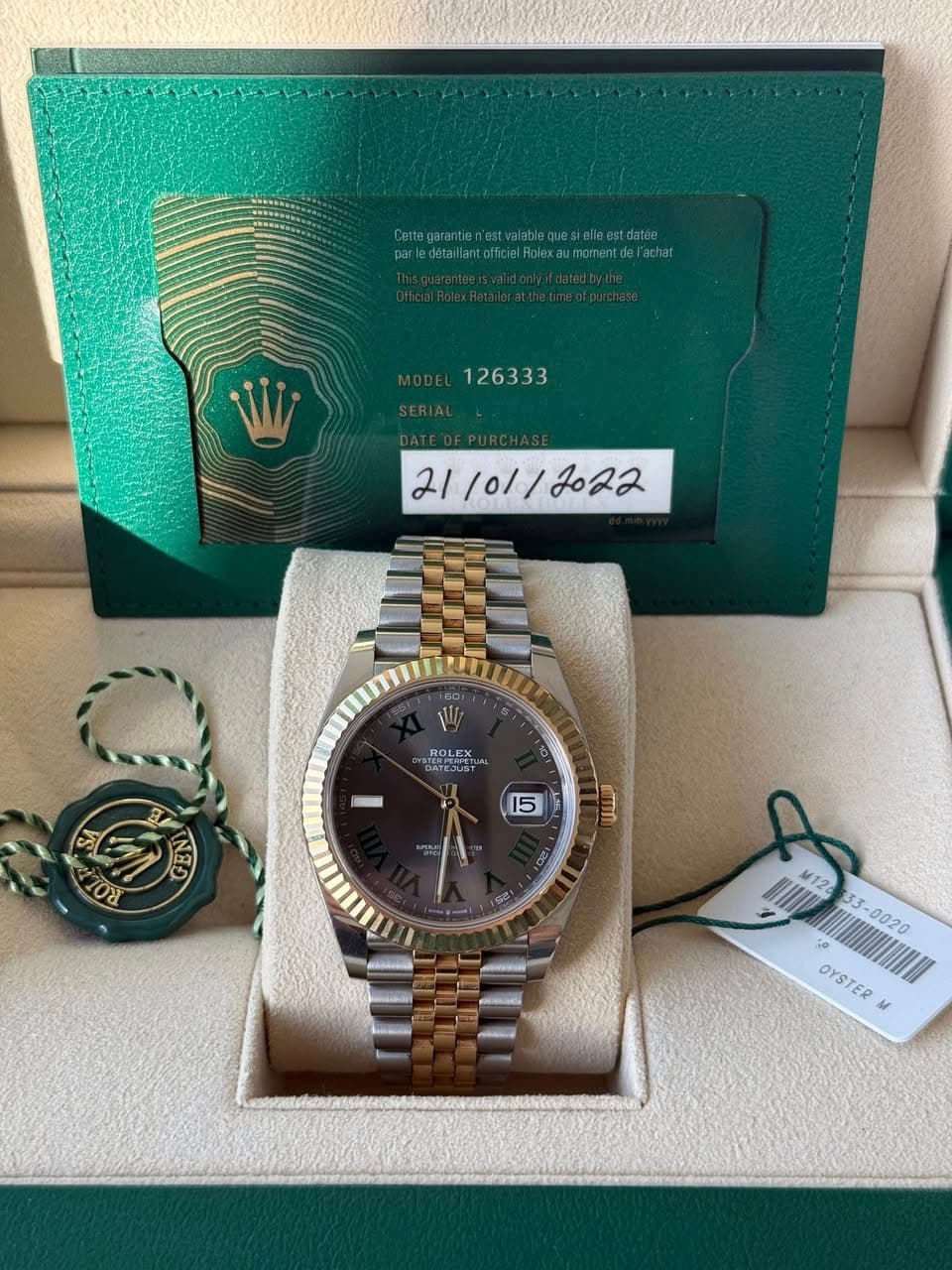 May be an image of wrist watch and text