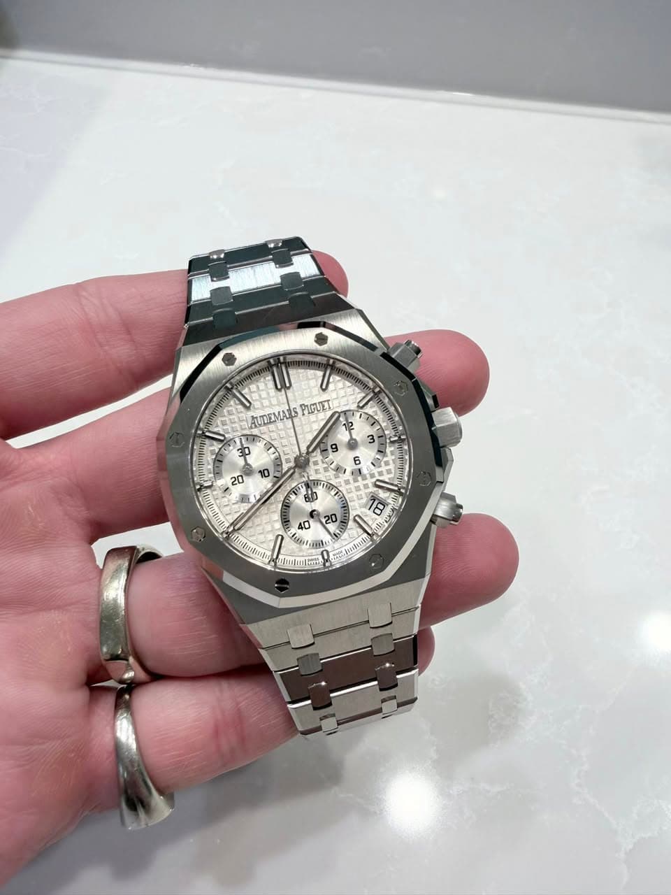 May be an image of wrist watch and text