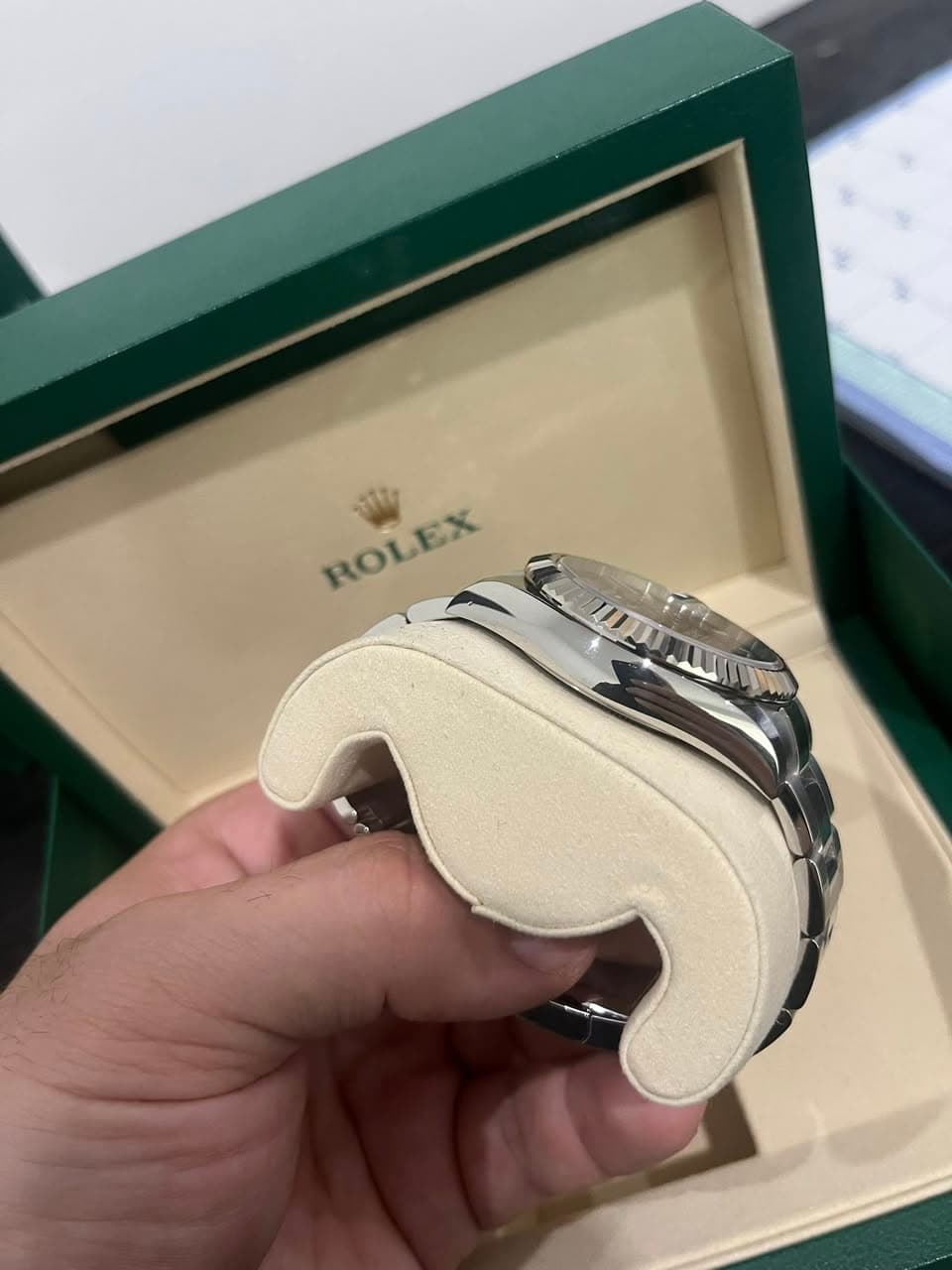 May be an image of wrist watch and text