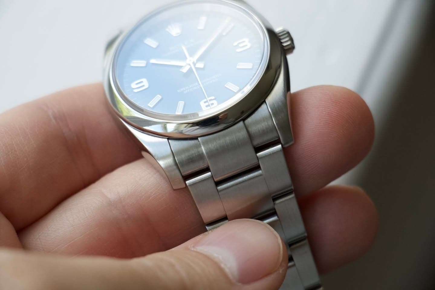 May be an image of wrist watch and text
