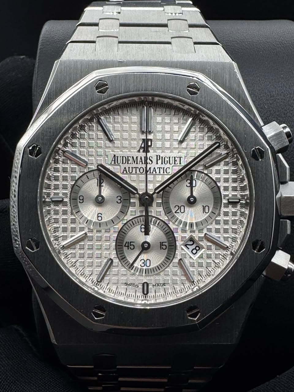 May be an image of wrist watch and text