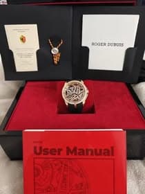 May be an image of wrist watch and text