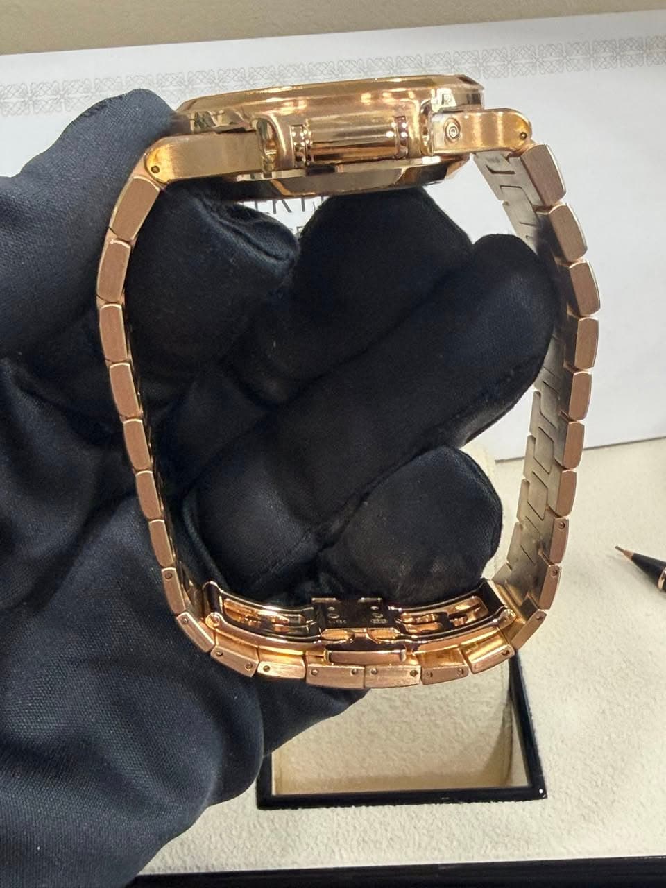 May be an image of wrist watch, jewelry and text