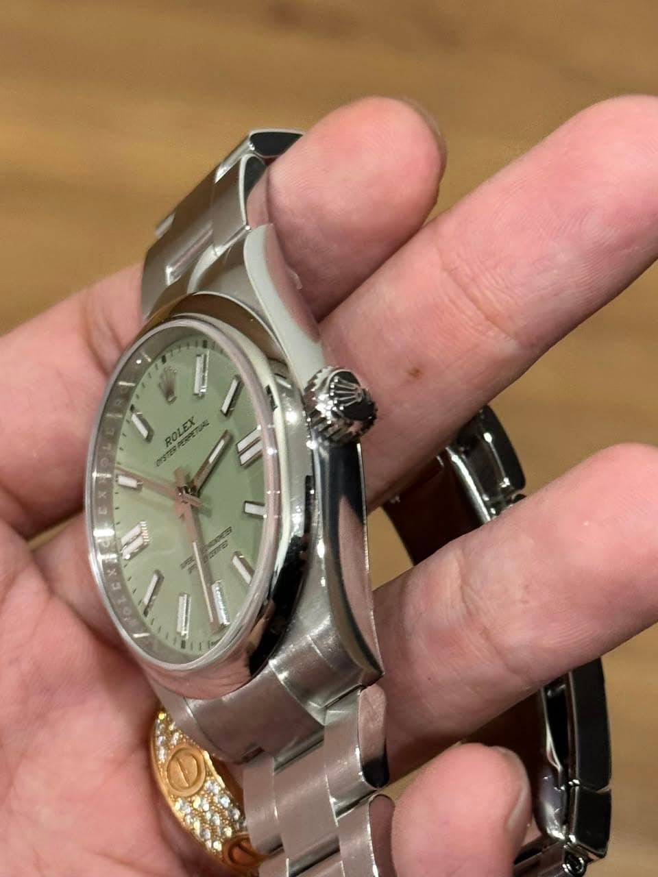May be an image of wrist watch and text