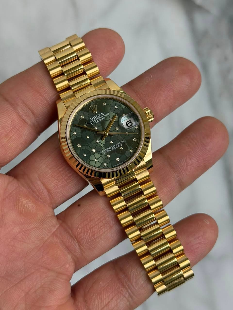 May be an image of wrist watch and text