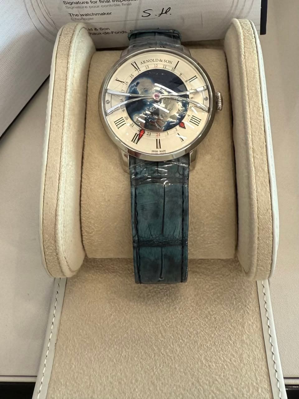 May be an image of wrist watch and text