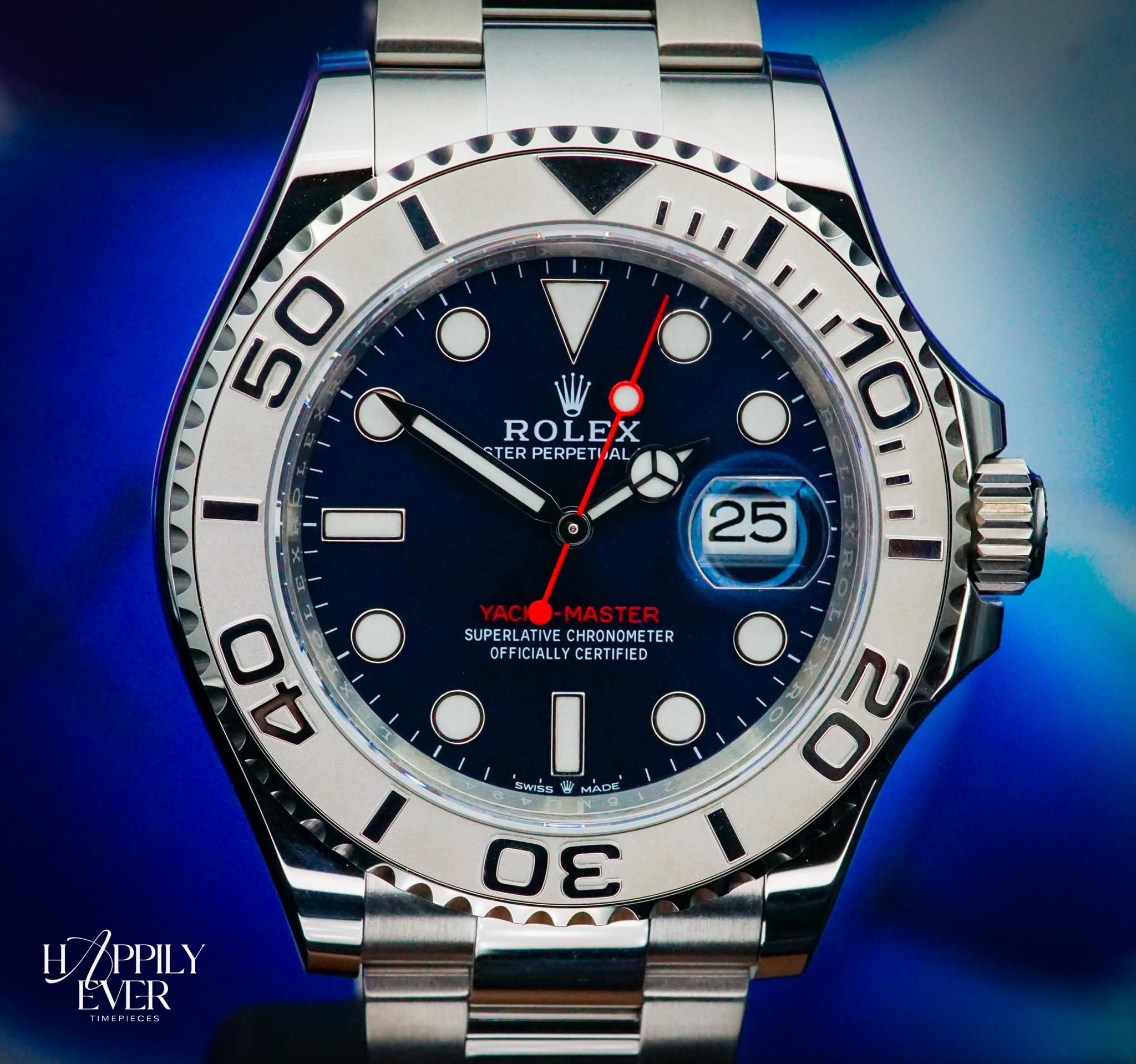 May be an image of wrist watch and text that says '50 0 ROLEX STER TERPERPETIAL 1 ® 25 YAC MASTER SUPERLATIVE SUPERLATIVECHRONOMETE ATIVE CHRONOMETE ER SUPER OFFICIALLYCERTIFIE…