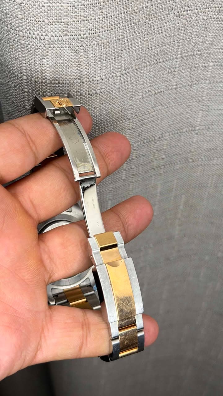 May be an image of wrist watch and text