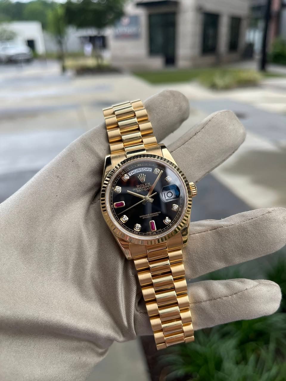 May be an image of wrist watch and text