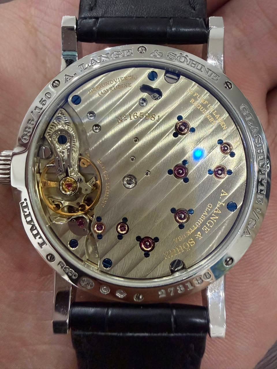 May be an image of wrist watch and text