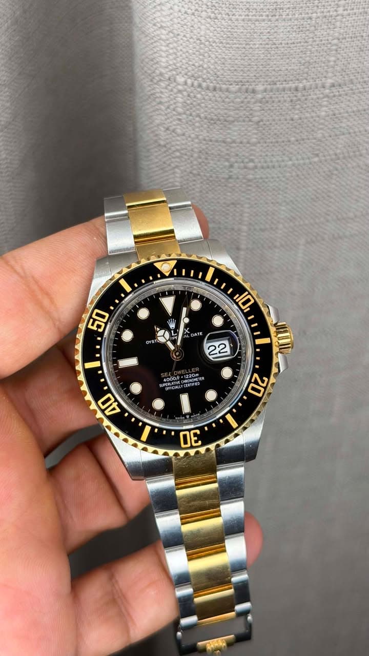 May be an image of wrist watch and text