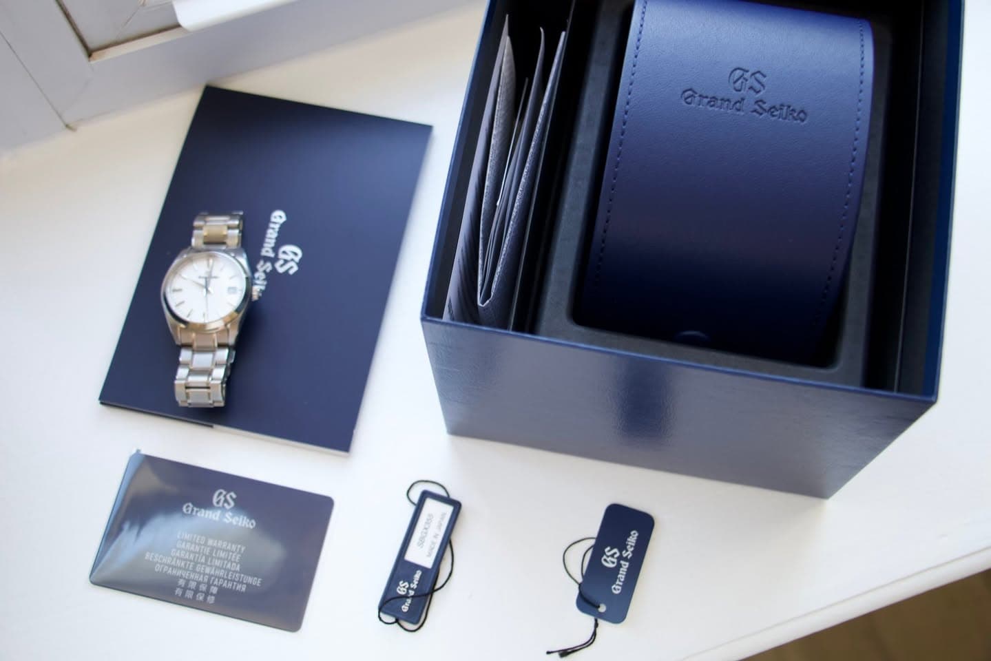 May be an image of wrist watch and text