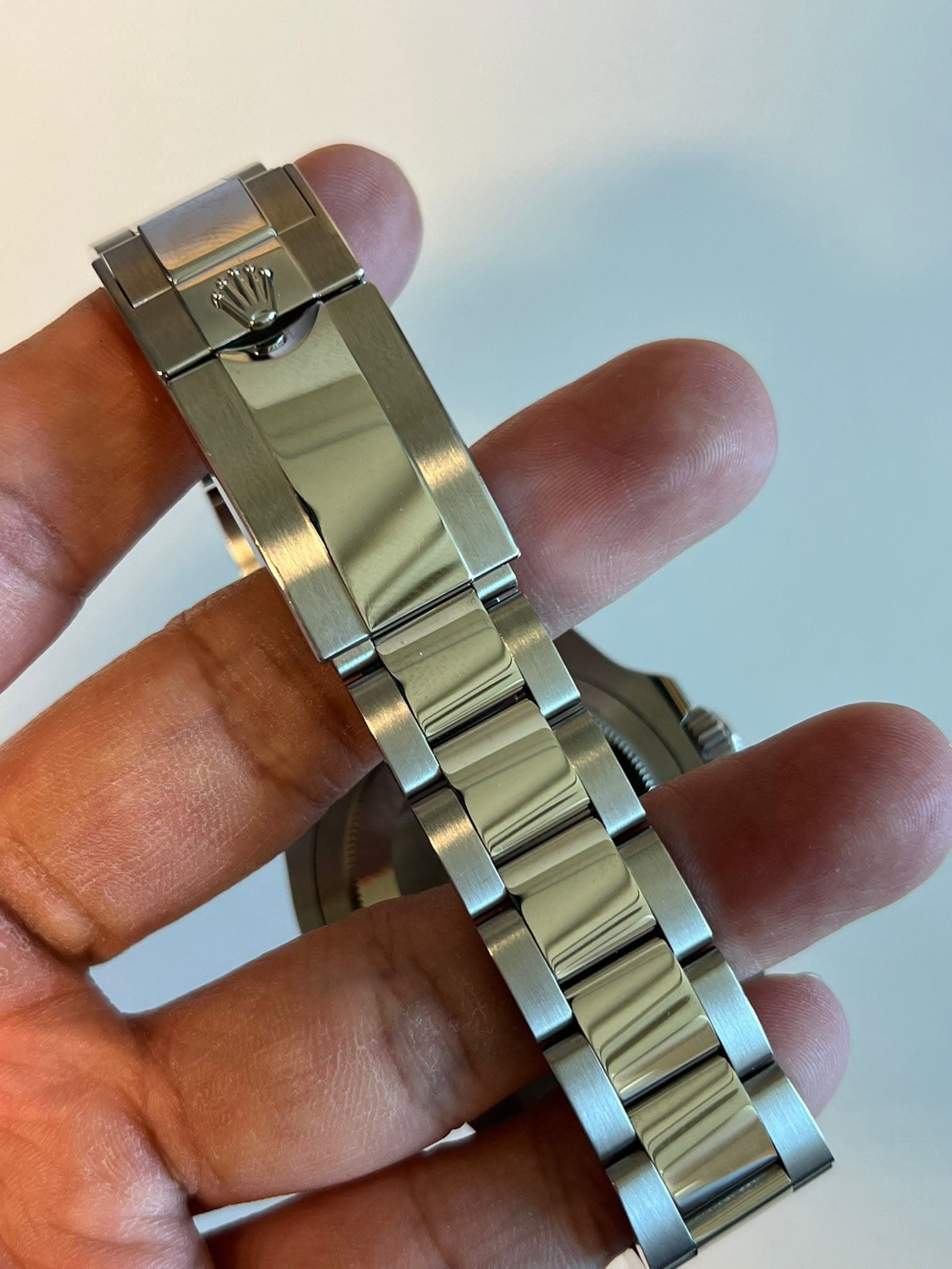 May be an image of wrist watch and text