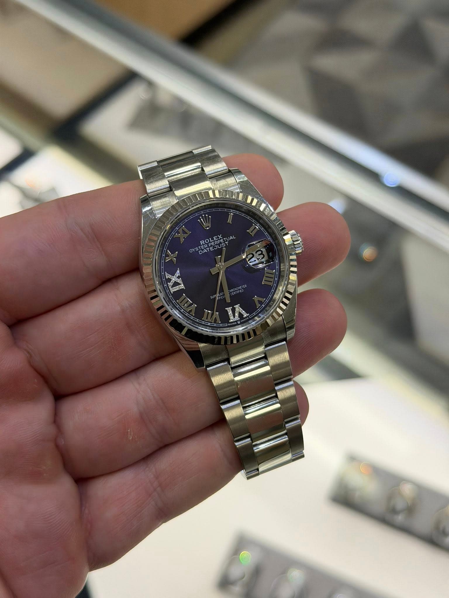 May be an image of wrist watch and text