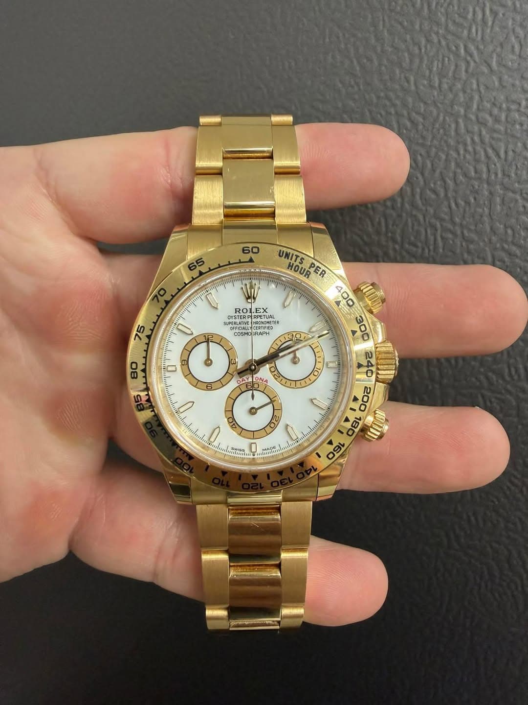 May be an image of wrist watch and text