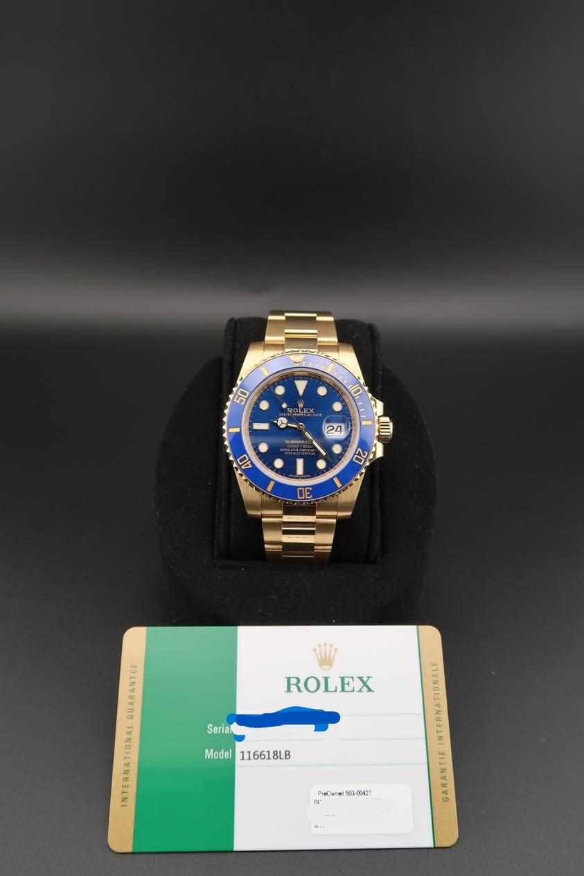 May be an image of wrist watch and text that says '50 10 MEH OLEX 24 40 20 ЛE ROLEX Seriak GUARANTEE INTERNATIDNAL Model Model116618LB 116618LB A የመበልንብ፣ 1G-00427 球'