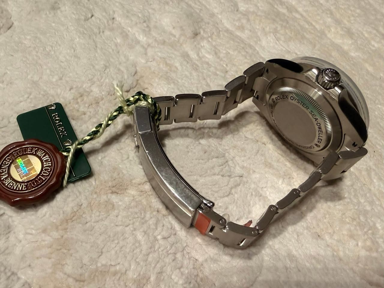 May be an image of wrist watch and text