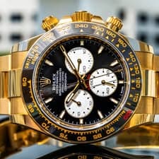May be an image of wrist watch and text