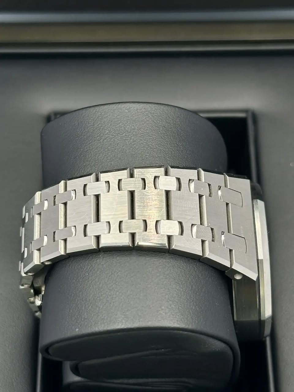 May be an image of jewelry, wrist watch and text